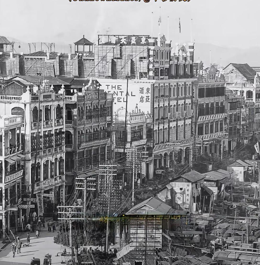 这是1920年的广州长堤大马路，当年摄影师站在一栋不知名的高楼上，镜头向东为我们