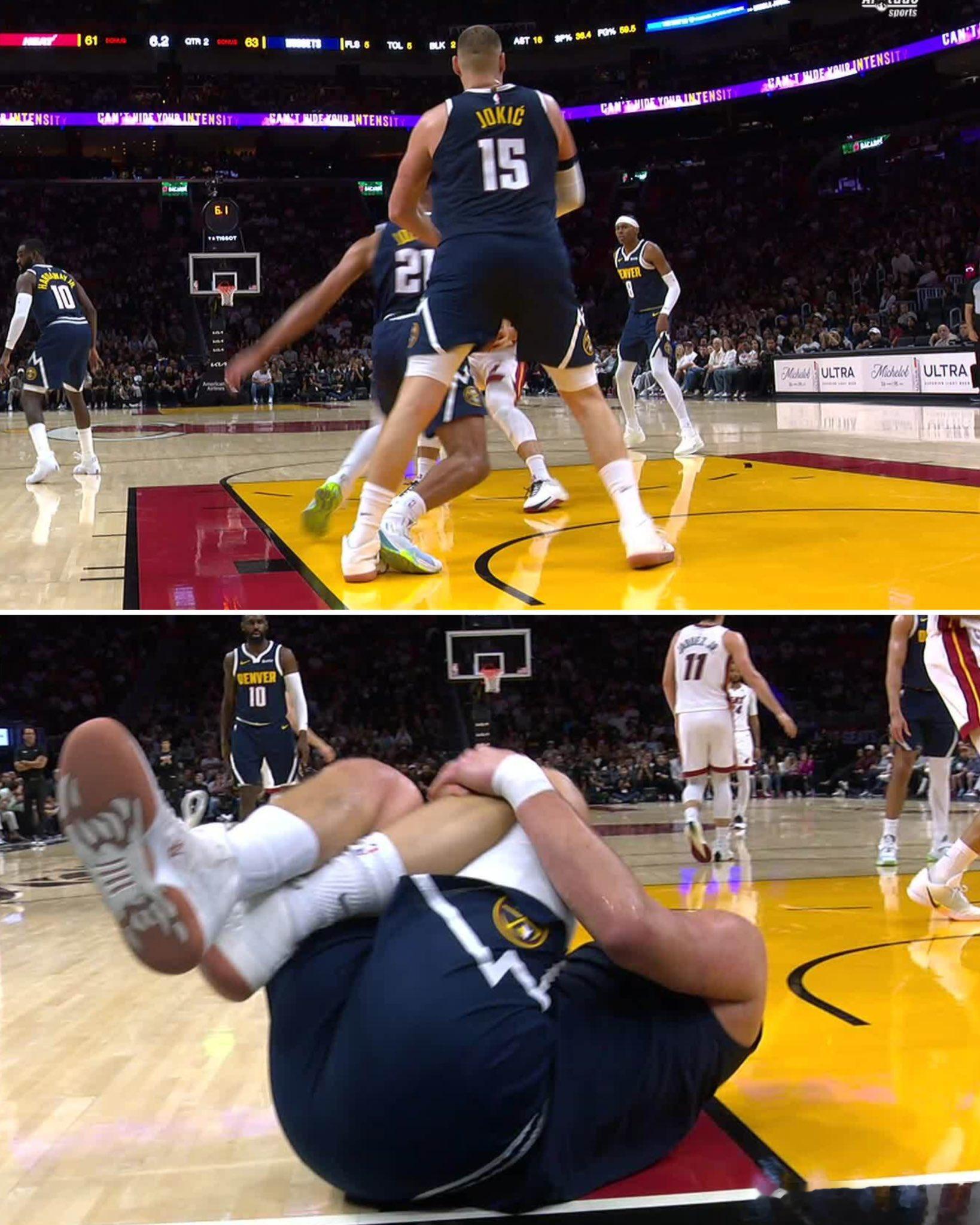 约基奇左腿受伤 被队友琼斯误伤！琼斯防守中后撤，但是不慎踩到了约基奇的左脚，约基