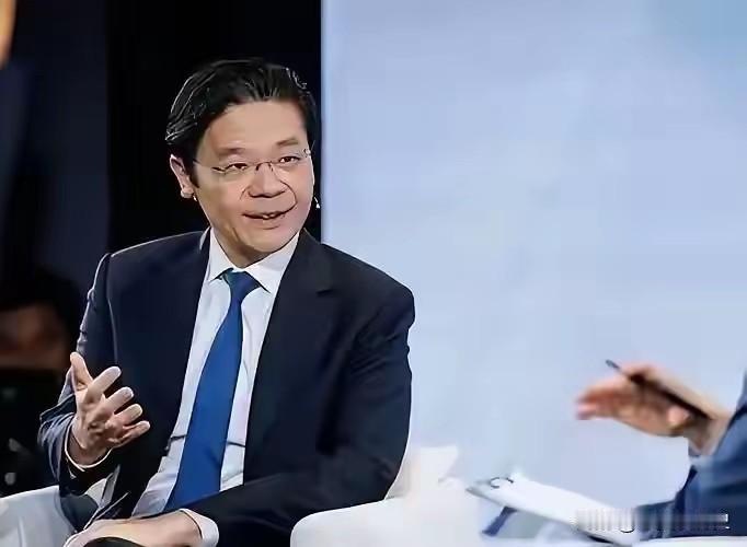 新加坡总理黄循财坐在加拿大电视台的聚光灯下，神情急切，语速紧凑，像急于递交一份“