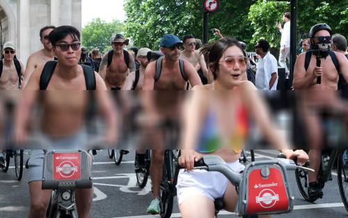 6月14日，荒诞的一幕出现在英国伦敦街头。一千多裸体人，骑着单车穿行在闹市。

