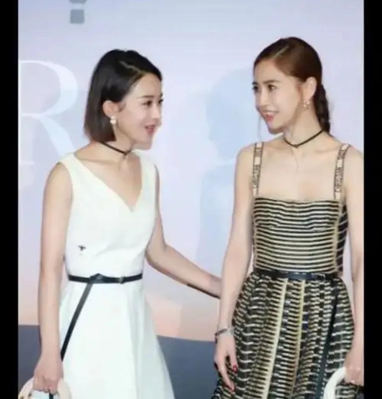 赵丽颖穿绿叶裙时，广袖流仙的古典造型温婉如画，抹胸刺绣款则凸显直角肩与小蛮腰，甜