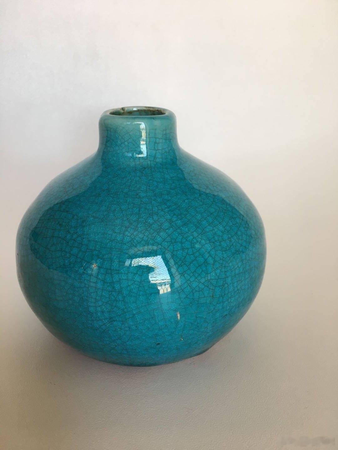 每周鉴赏收藏精品之孔雀蓝咕噜瓶        咕噜瓶可能是古代酒瓶中最讨喜的器型