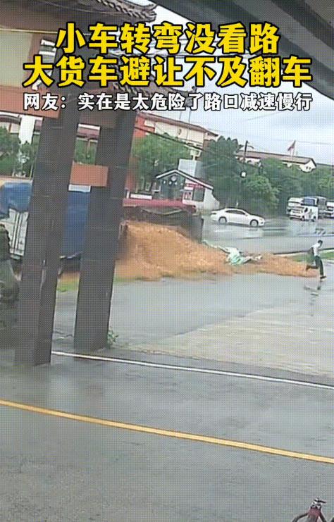 7月2日报道，江西，一辆大货车正常行驶在道路上，走到一个岔路口，一辆白色轿车突然