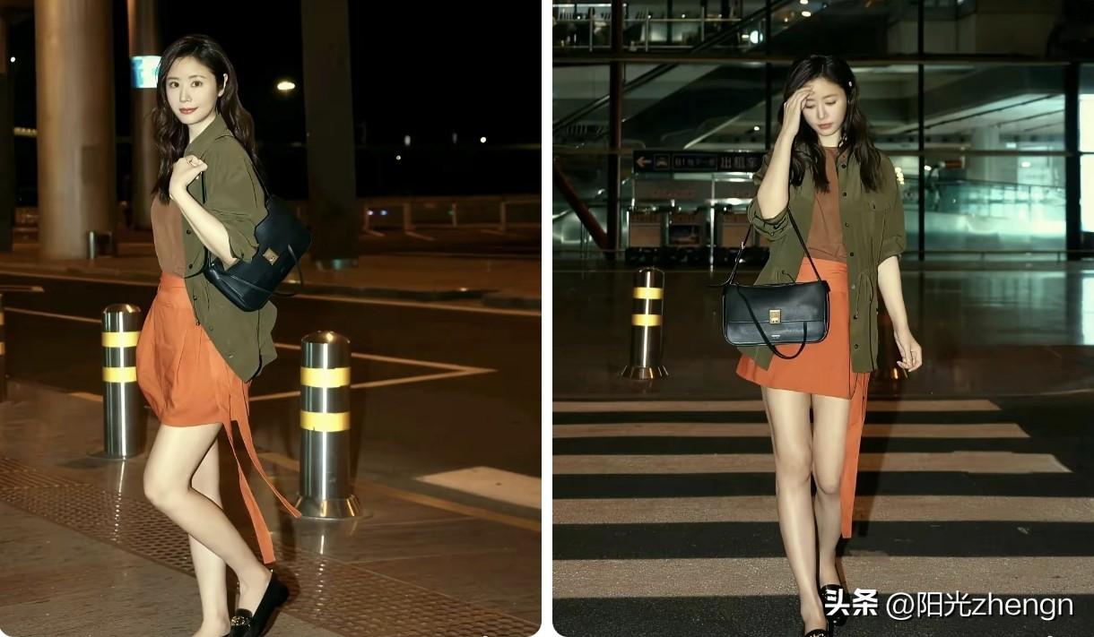 这组机场路透，林心如一出场就亮眼。军绿外套搭配橙色飘带短裙，撞色大胆又耐看，长腿