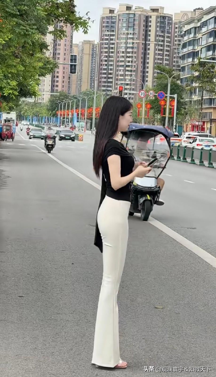 一点交通安全意识都没有吗？站在马路上拍视频太危险了！