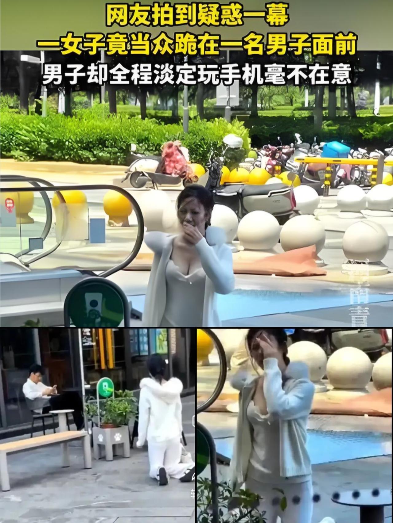 5月16日上海街头的一幕，
看得人直摇头，一名衣着清凉的年轻女子当众跪在男子身前