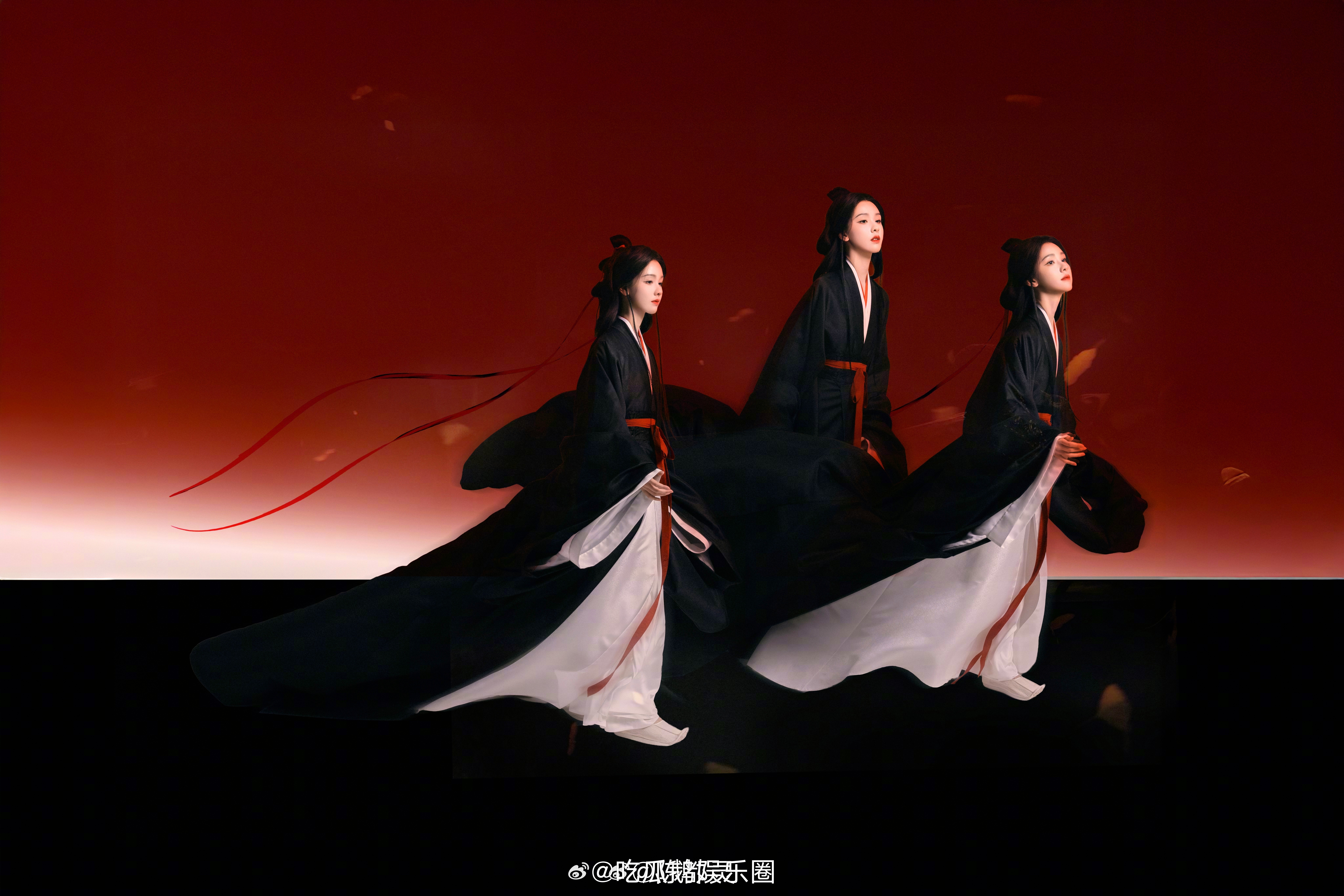 陈都灵黑衣红绸造型陈都灵黑袍执剑风扯红绸落于玄色衣襟，握剑凝眸神色淡然，陈都灵用