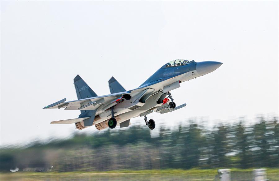 A fighter jet attached to an aviation br