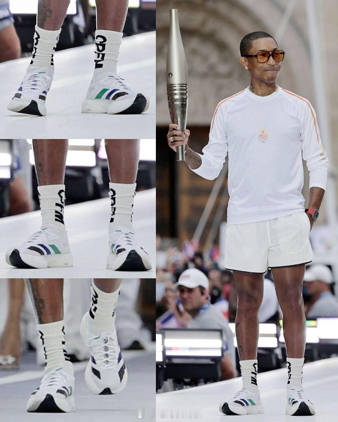 Pharrell Williams 菲董在巴黎奥运会火炬传递中穿的是阿迪达斯 a