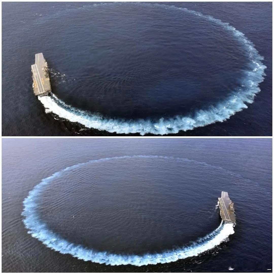 印度海军自制航母“维克兰特”号在海上分别进行左、右大回旋。甲板很干净，可能是试航