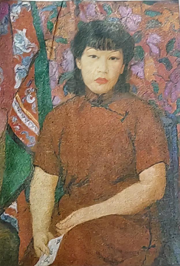潘玉良的《红衣自画像》    
        这油画太有魅力了。画中的她身着红