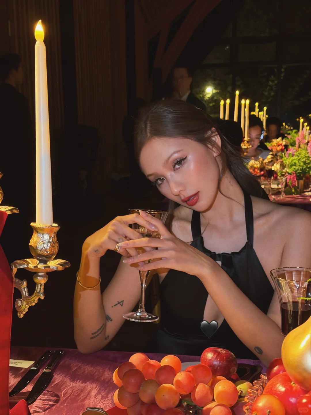 Dressed in black, glowing in gold