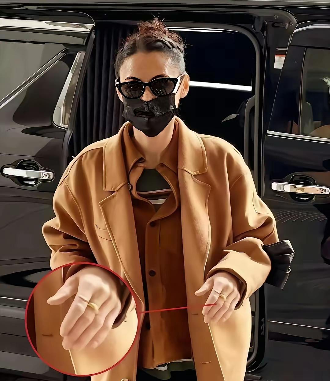 张柏芝出庭时，镜头扫过她的手——不是女明星精致保养的样子，指关节突出，手心还有层