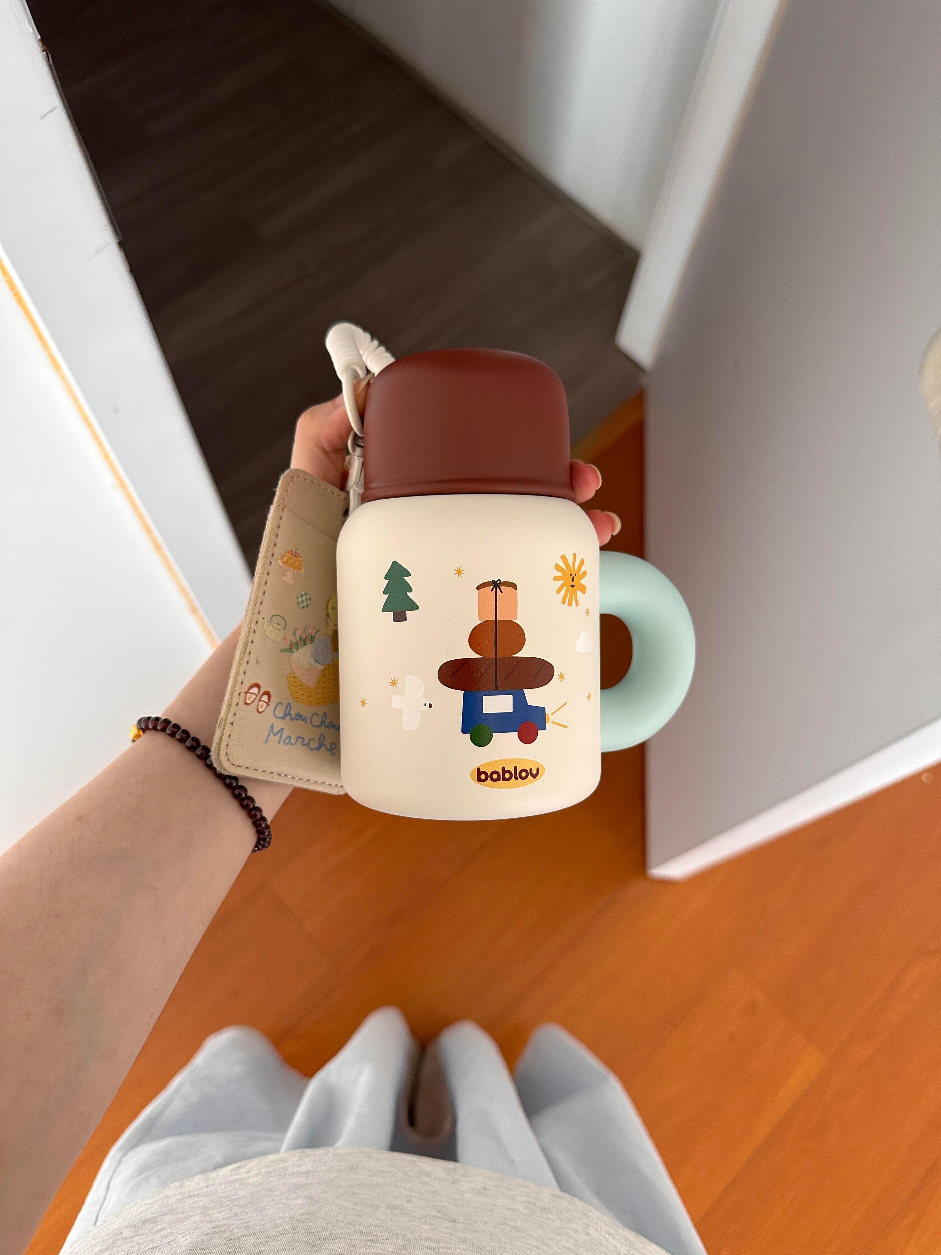 切….没有义务分享这么可爱的杯子吧秋冬有着落咯 ​​​