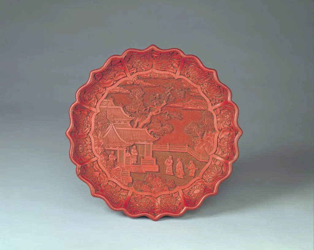 剔红携琴访友图莲瓣式盘