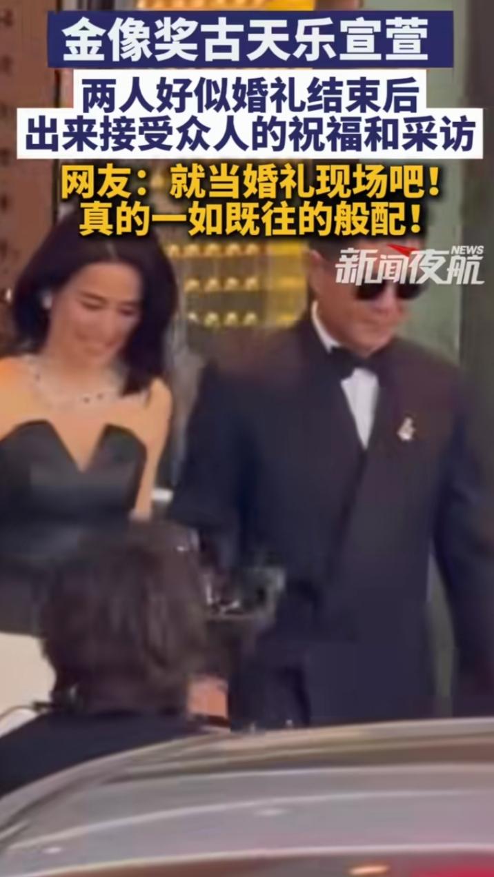 被记者团团围住的古天乐和宣萱，活像刚走完仪式的新人，一脸无奈又好笑。古天乐被追问