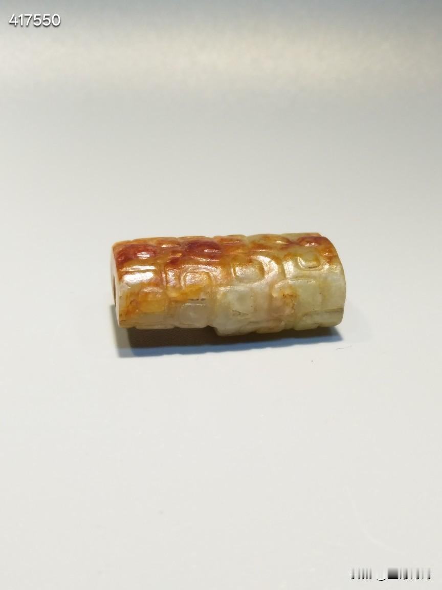 隐龙纹.玉勒
流行于:战国
和田黄玉红沁