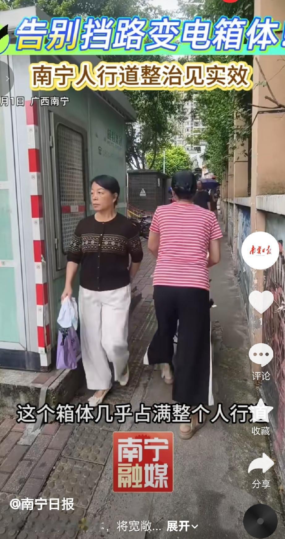 9月1日，南宁市第四十七中学校门前，一台红色起重机缓缓吊起一个绿色的预装式变电站