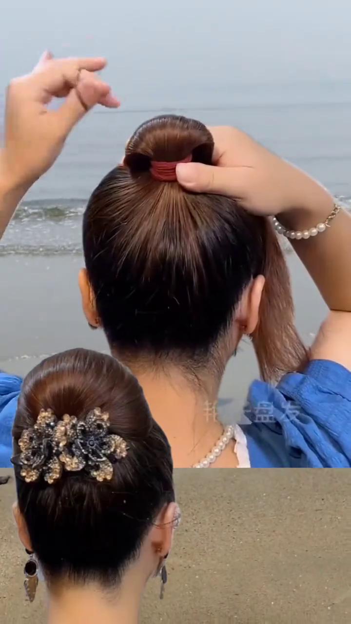 艳子盘发。
天热穿旗袍最好看的发型，学会了自己扎。