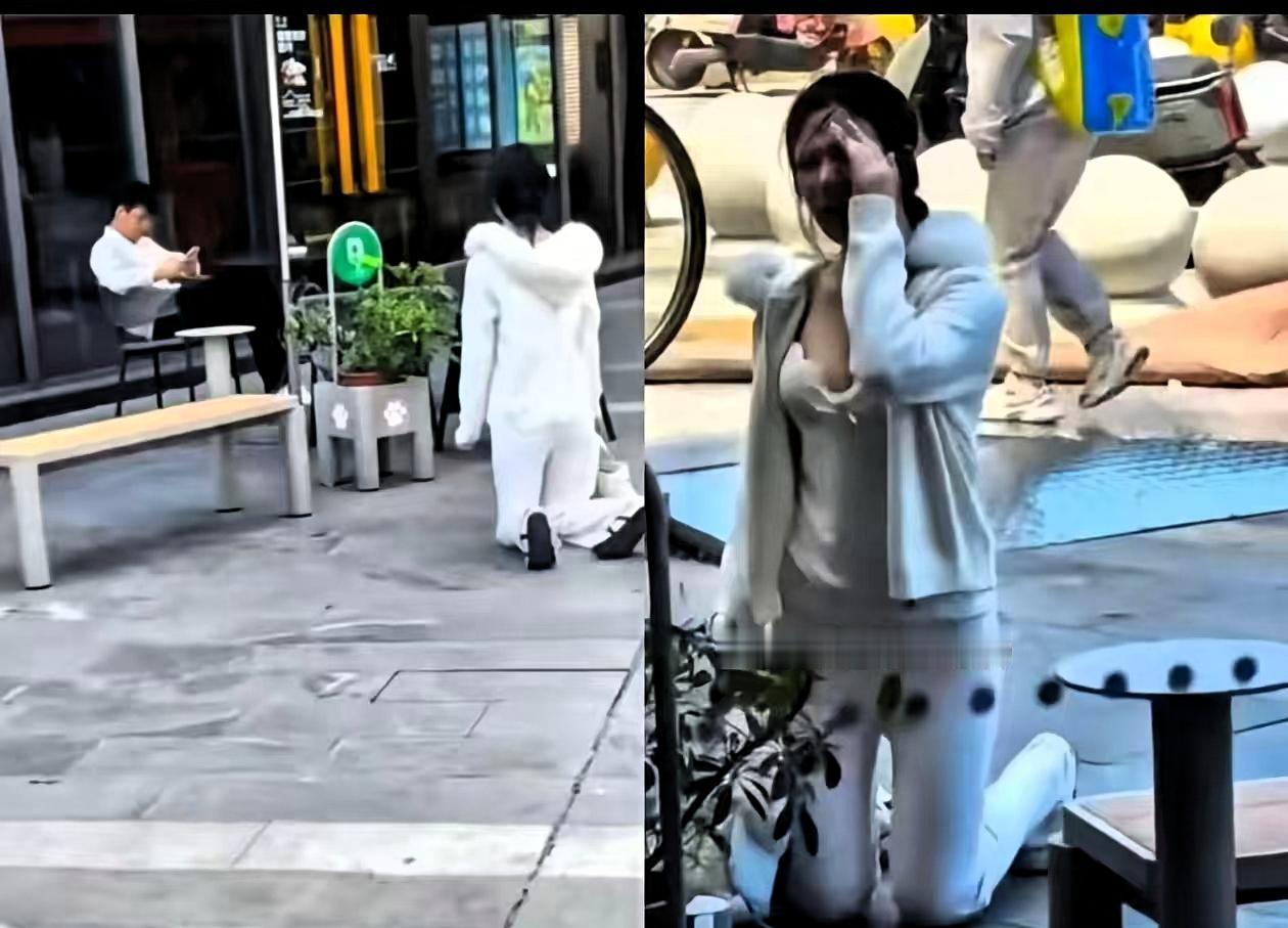 上海，5月16日，一个有些袒胸露乳的年轻姑娘，当街跪在一个男子面前，男子坐椅子上