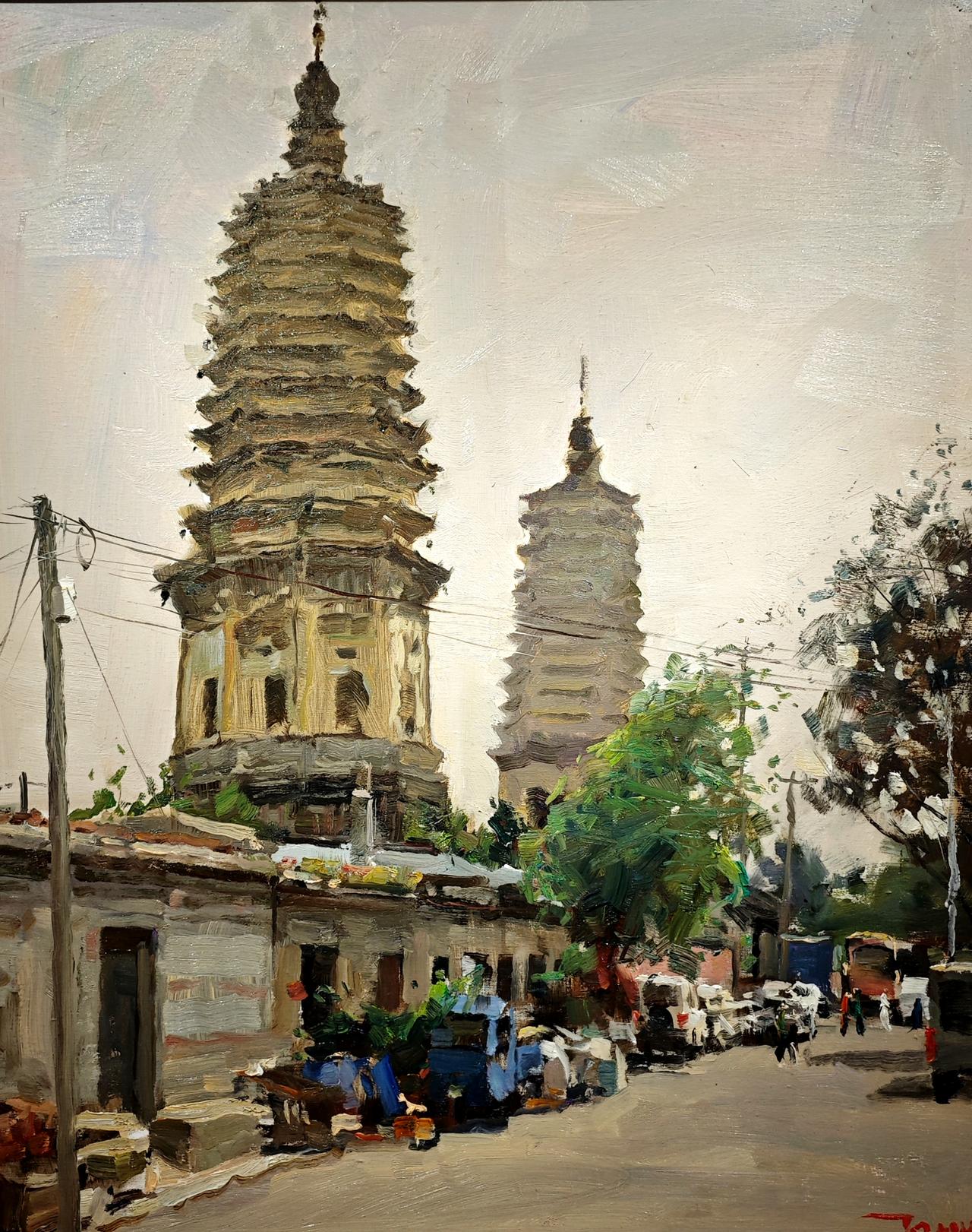 在北京中国美术馆，众多著名的油画中，画家王铁牛现场实地写生油画《北镇双塔》，让我