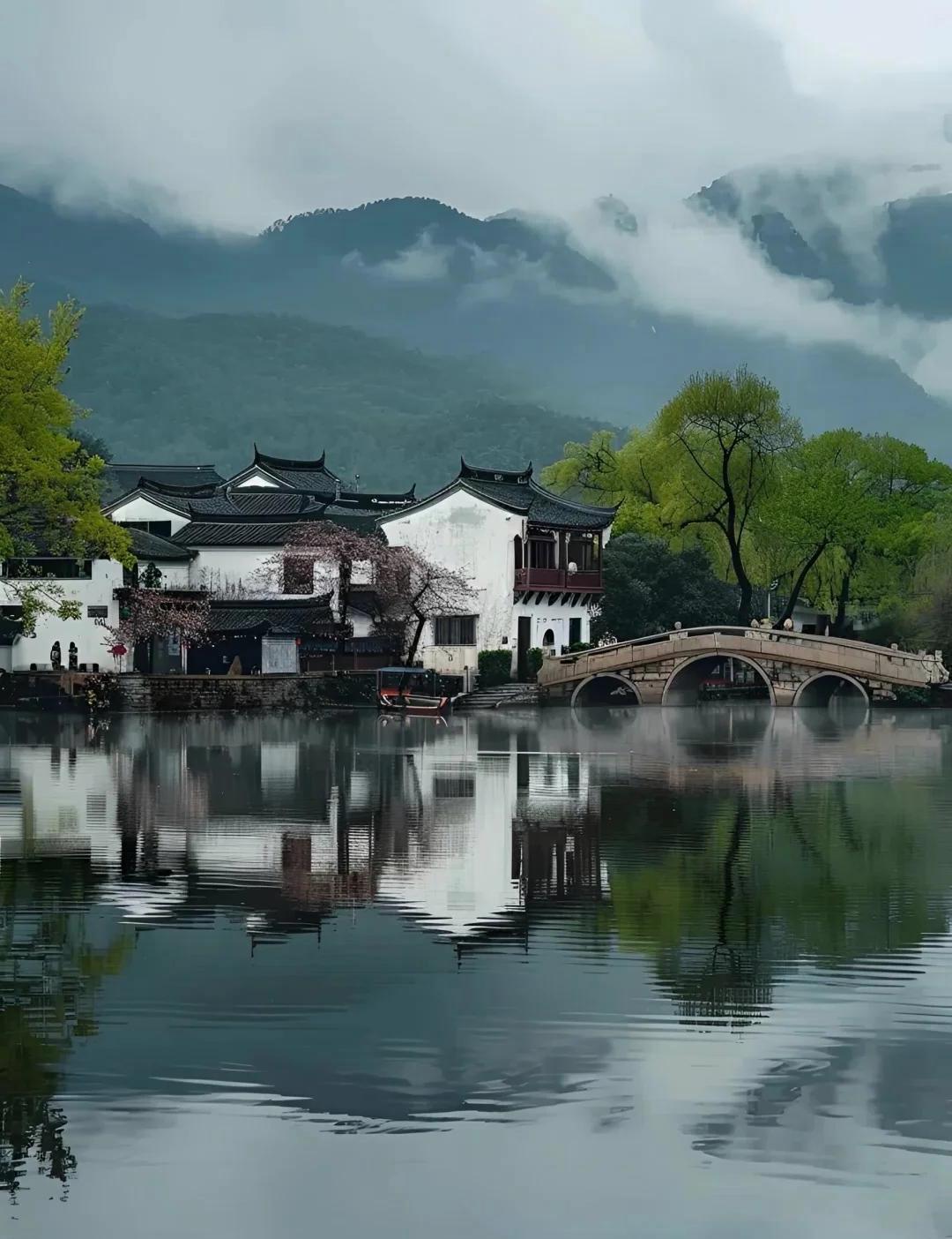 下联：风荷夏日西湖情

赏析：此联以“风荷”应“烟雨”，以“夏日”对“水乡”，时