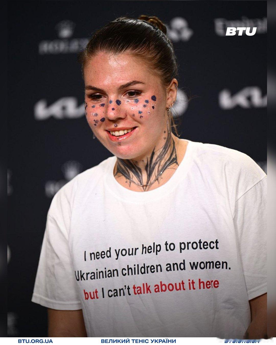 奥利尼科娃🇺🇦穿着这样一件T恤：“我需要你们的帮助来保护乌克兰儿童和妇女，但