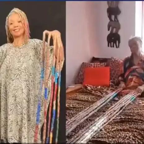 你敢信？美国有位女士28年没剪过指甲，双手指甲加起来总长超13米，光看数字都让人