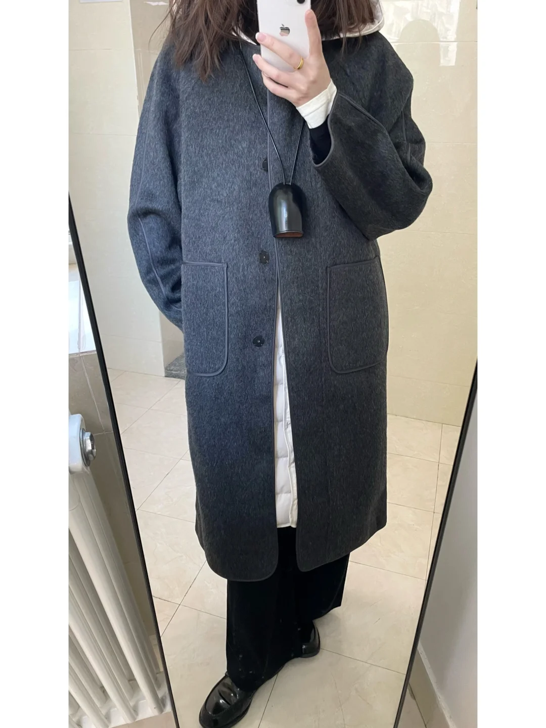 大衣里搭羽绒 冷不了一点