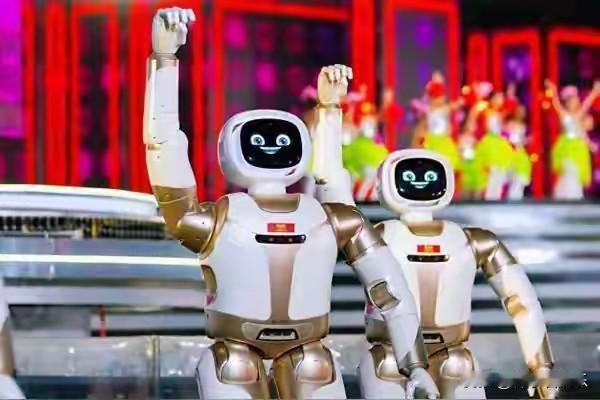 你敢信？昨晚春晚舞台，灯光璀璨如星河倾落，一群机器人身着鲜艳的民俗服饰闪亮登场。