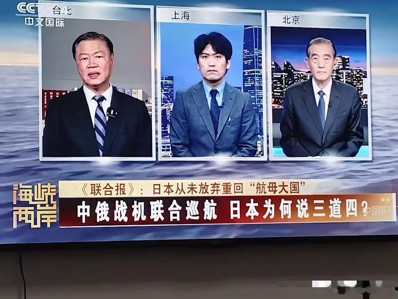 中间这个学者是我国一所著名高校研究日本问题的专家，无论从这个学者的装束打扮和音容
