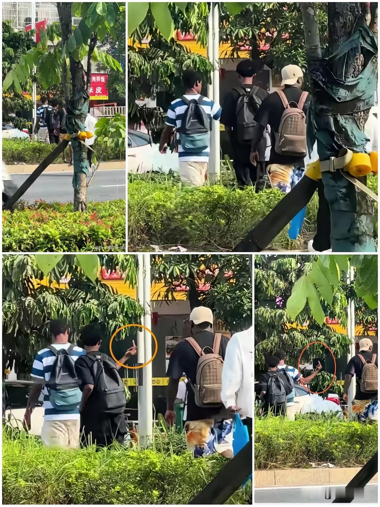几个外国留学生横穿马路，直接踩绿化带。被路人看了一眼，这帮人直接竖中指挑衅，恶狠