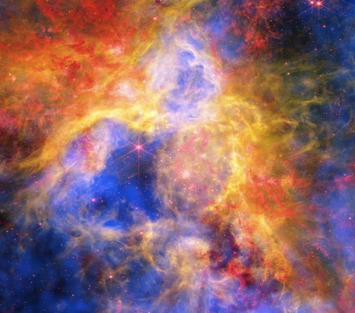用恒星风的斑斓色彩绘就宇宙画卷🎨✨

来自NASA哈勃空间望远镜、钱德拉X射线望远镜和詹姆斯·韦布空间望远镜的数据相结合，为我们呈现出一幅绚丽多彩的狼蛛星云景象。

这片恒星形成区距离地球约16万光年，是宇宙中一个充满新生恒星与强烈恒星风的壮观“恒星育婴室”。 ​