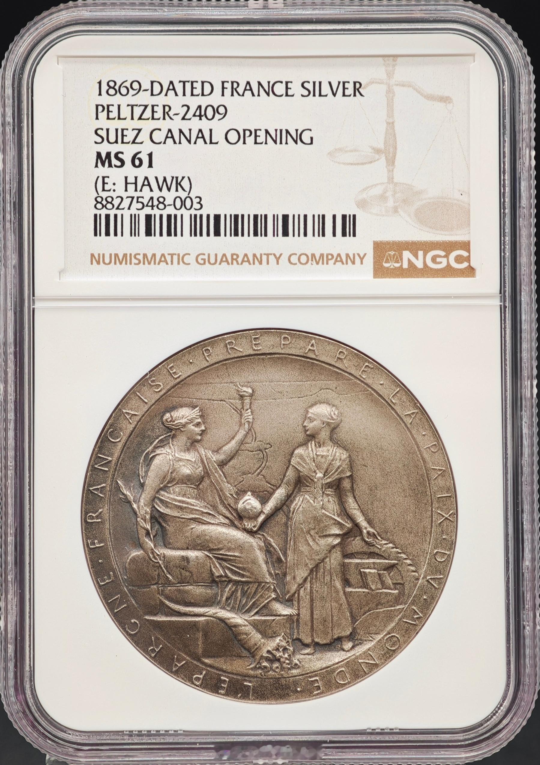 NGC-MS61法国1869年苏伊士运河开通纪念银章，由19世纪末法国著名的新艺术运动雕刻大师奥斯卡·罗蒂雕刻设计。 它是西方大工业时代与徽章雕刻艺术巅峰时期的经典名作。

由于苏伊士运河的开通由法国外交官、实业家斐迪南·德·雷赛布主导，这枚由苏伊士运河公司官方发行的纪念章带有浓厚的古典法国象征主义 ​
